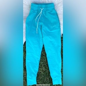 NVGTN teal joggers small